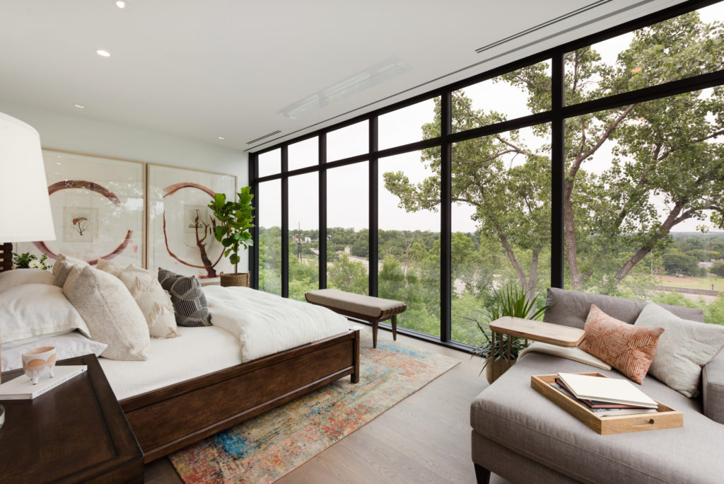 Bedroom with an open view of the outdoors.