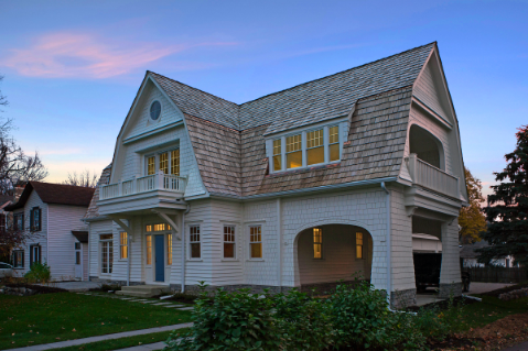 A large barn style home during sun down